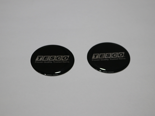 52001 WHEEL COVER EMBLEM, BLACK/SILVER  INCHTESCO INCH